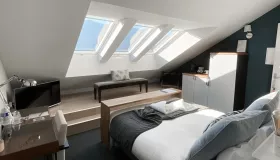 Photo de la chambre classique la Colombier de l'hôtel les Suites du Lac.